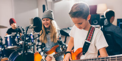 kids rock band in music studio